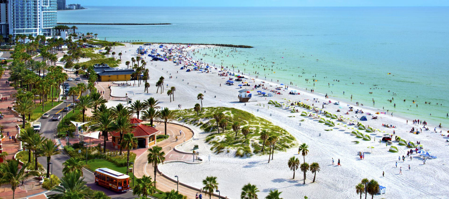 Beachfront hotels along Clearwater Beach with families on the sand